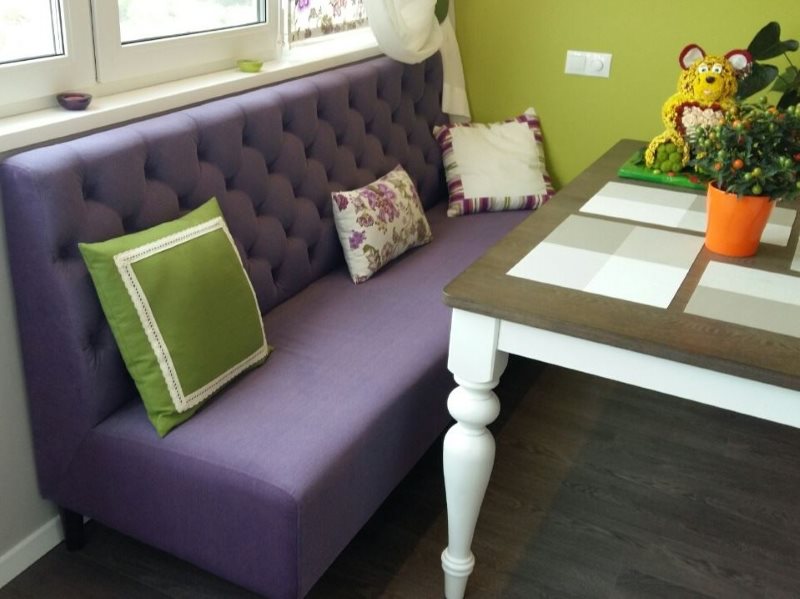 Narrow sofa with purple upholstery