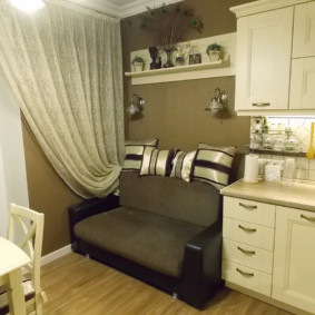 Compact sofa at the end of the kitchen