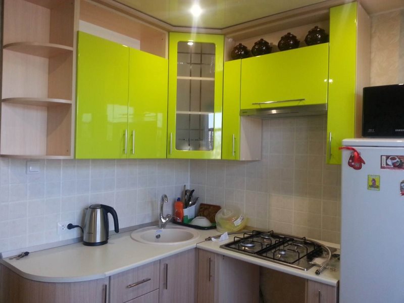 Light green facades of hanging cabinets for a kitchen set