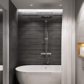White bath in rooms with gray tiles.