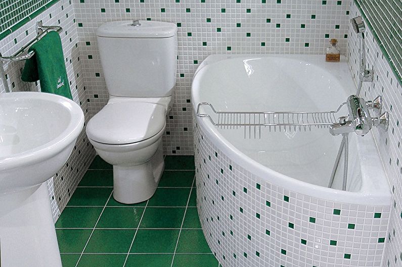 Compact corner bathtub next to the toilet