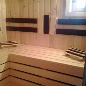 Wooden headrests in the steam room