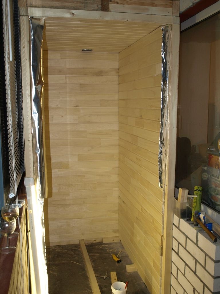 Pine lining as a wall decoration of a balcony sauna