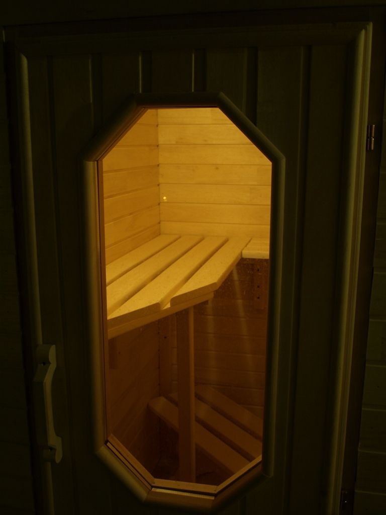 Window in the door of the balcony sauna