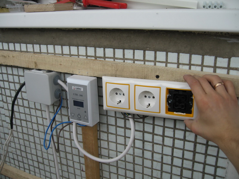 Installation of sockets for a sauna on a loggia wall